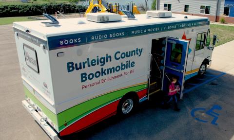 Burleigh County Bookmobile parked at a school