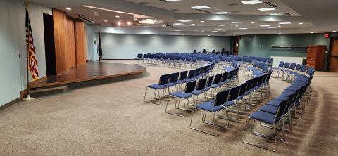 Meeting room with stage and chairs