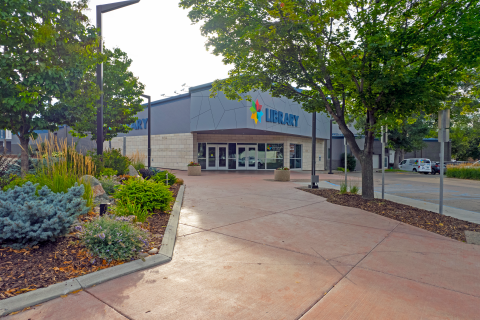 Library building and entry plaza and garden in summer